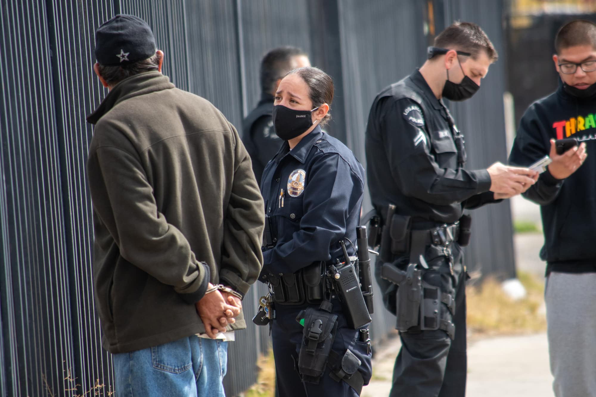 Northridge, California / USA - March 8, 2021: A diverse group of LAPD officers and supervisors respond to an assault investigation in Northridge, adjacent to a housing project on Parthenia.